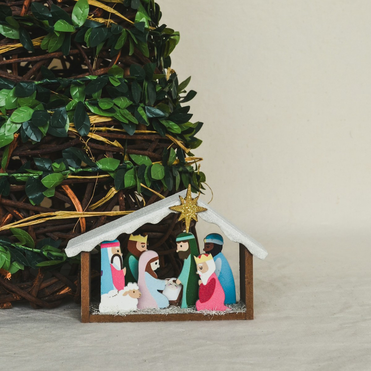 A nativity scene of three wise men and a baby jesus in a manger