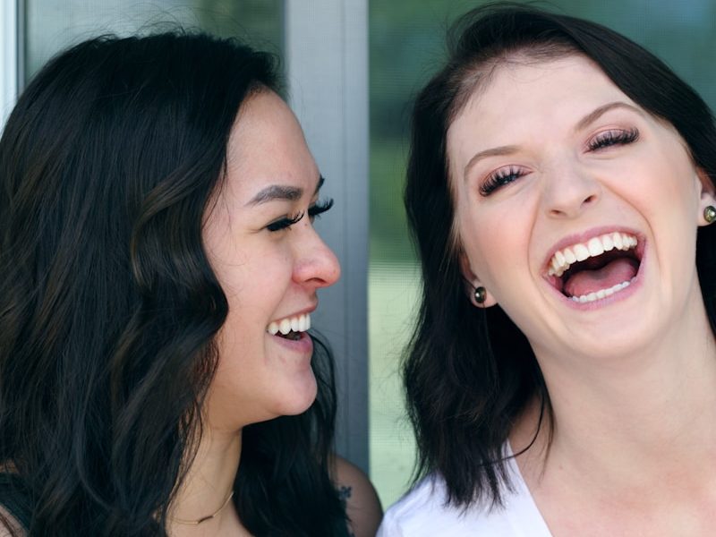 two woman laughing